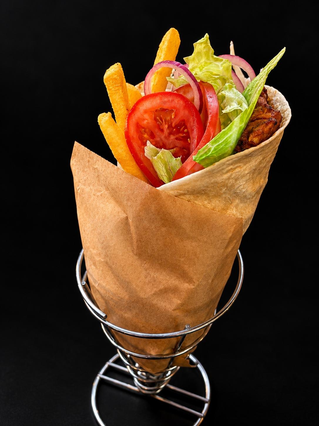Chicken wrap with vegetables and potato fries
